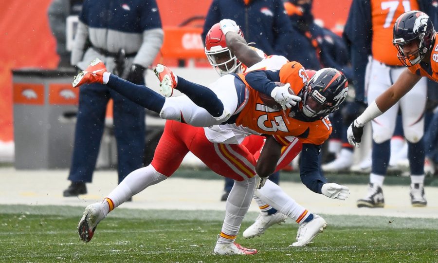 DENVER, CO - OCTOBER 25:  K.J. Hamler #13 of the Denver Broncos is tripped up before being tackled in the third quarter of a game against the Kansas City Chiefs at Empower Field at Mile High on October 25, 2020 in Denver, Colorado. (Photo by Dustin Bradford/Getty Images)